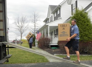 Triangle mover loading box into truck