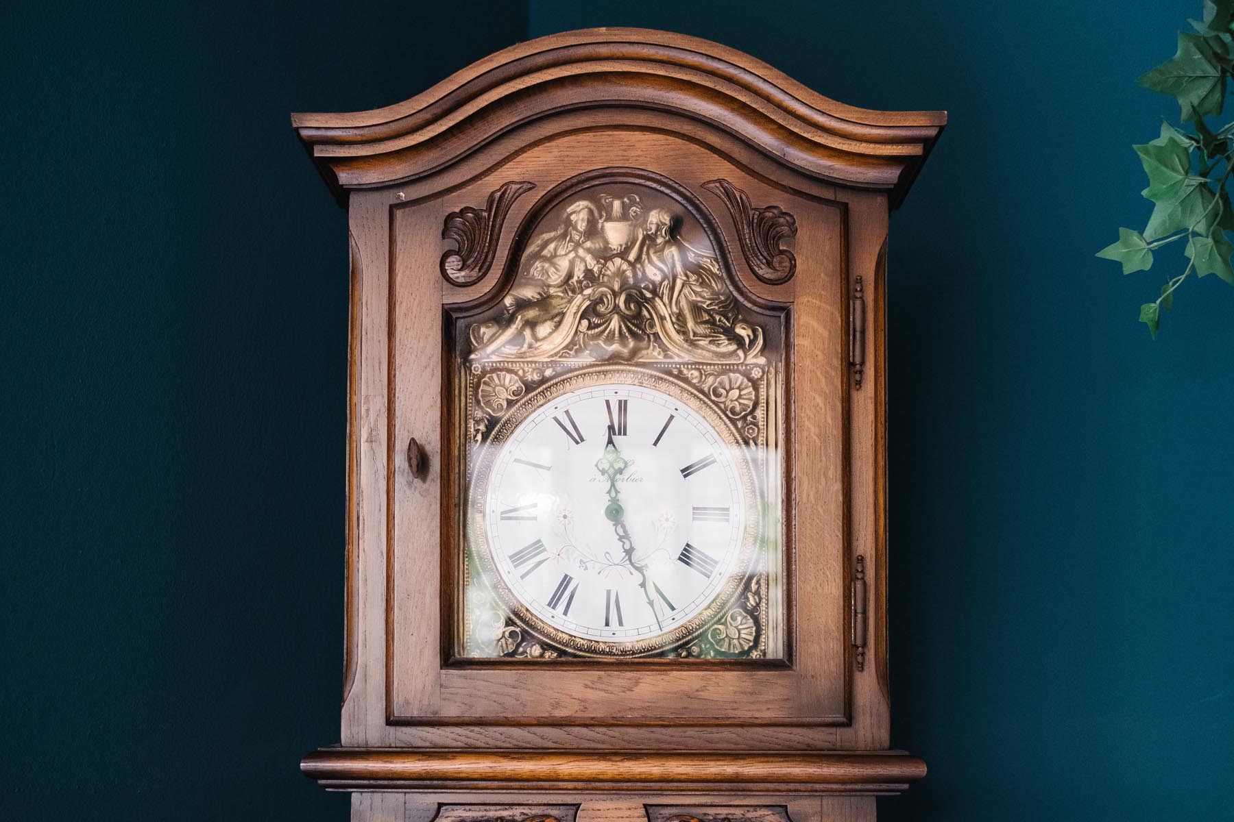 an antique clock on a background